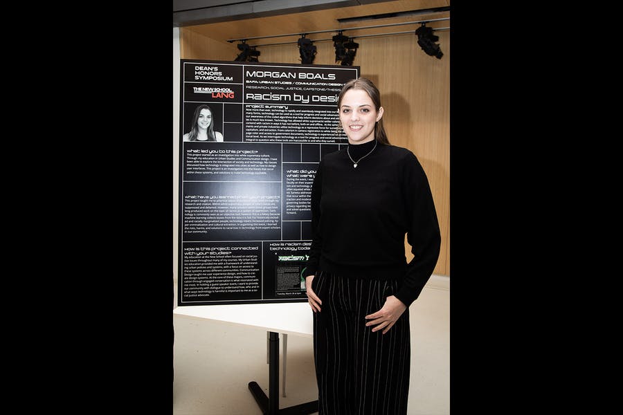 Morgan Boals stands in front of her presentation poster at the Dean's Honor Symposium