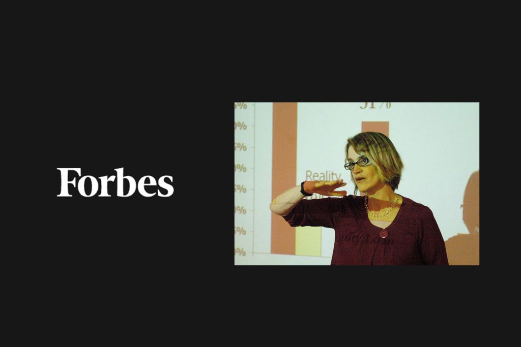 The Forbes masthead next to Teresa Ghilarducci lecturing in front of a chart