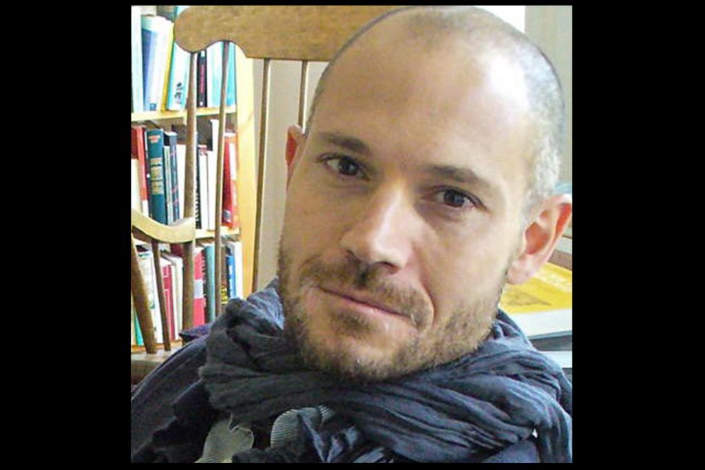 Close-up of Omri Boehm in his office