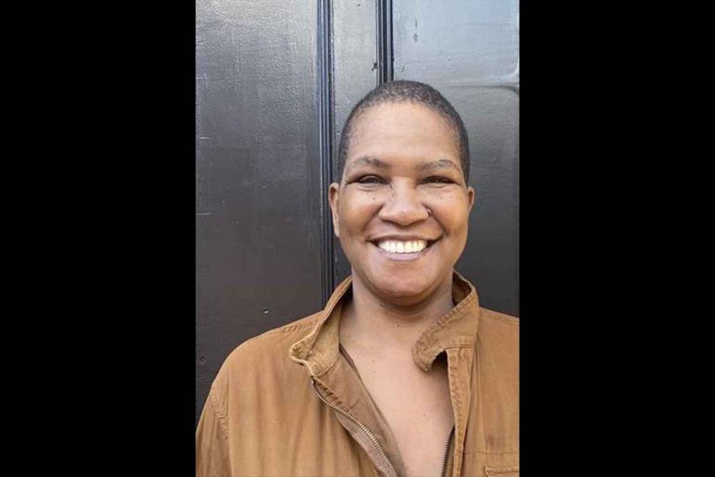 Headshot of Pamela Sneed smiling at camera